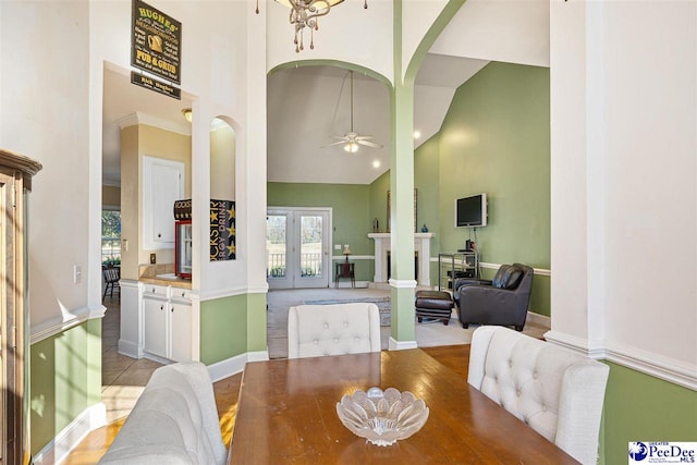 dining room with ceiling fan, high vaulted ceiling, and french doors