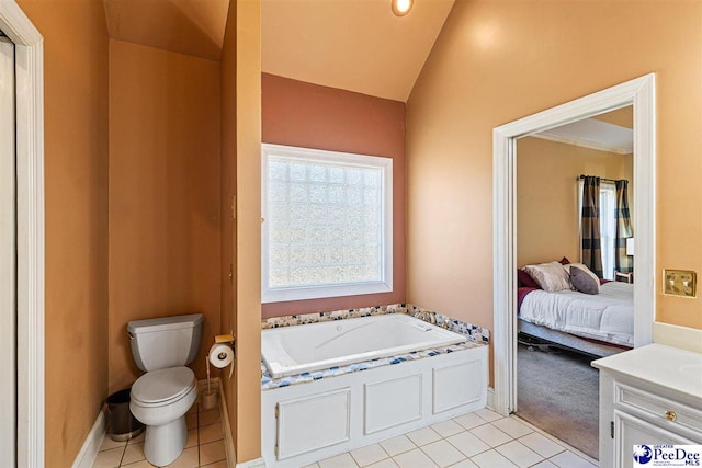 bathroom with tile patterned flooring, a bathtub, vaulted ceiling, and toilet