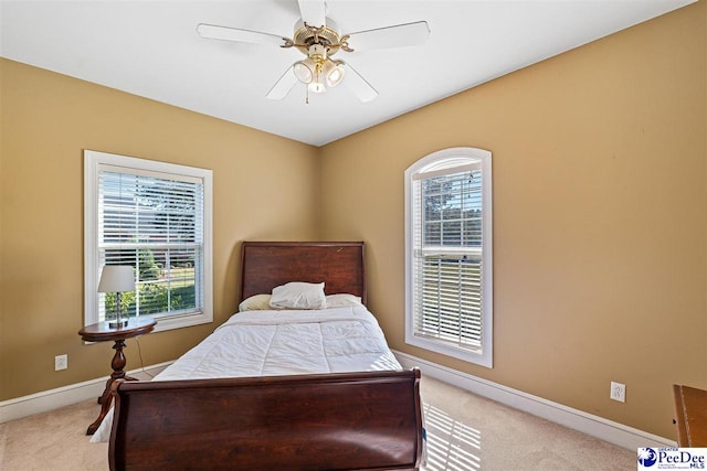 carpeted bedroom featuring ceiling fan