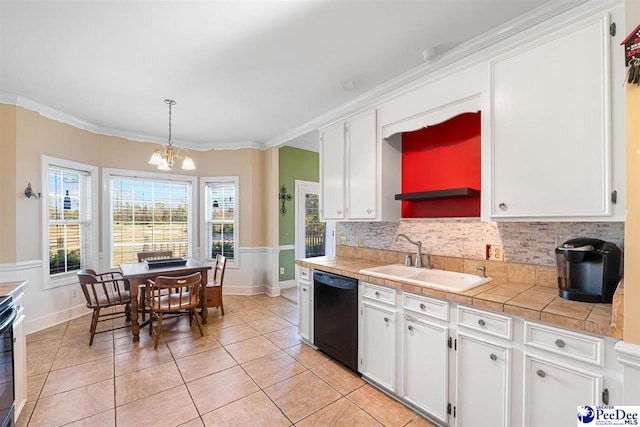 kitchen featuring pendant lighting, black dishwasher, sink, and white cabinets