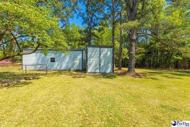 616 Forest Acres Dr, Pamplico, SC 29505 - view of shed featuring fence