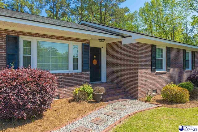 616 Forest Acres Dr, Pamplico, SC 29505 - view of exterior entry featuring brick siding and crawl space