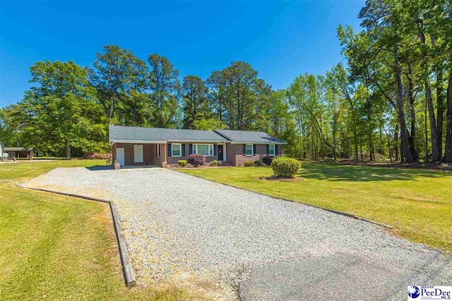 616 Forest Acres Dr, Pamplico, SC 29505 - single story home with an attached carport, gravel driveway, and a front yard