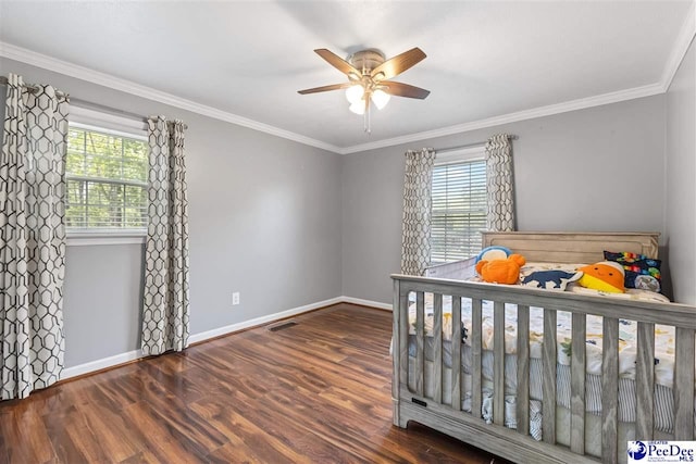 616 Forest Acres Dr, Pamplico, SC 29505 - bedroom featuring visible vents, multiple windows, baseboards, and wood finished floors