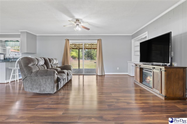 616 Forest Acres Dr, Pamplico, SC 29505 - living area featuring ornamental molding, ceiling fan, dark wood-style floors, and a healthy amount of sunlight