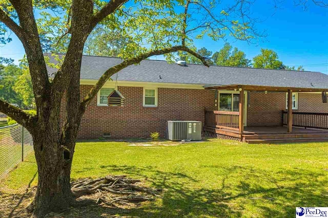 616 Forest Acres Dr, Pamplico, SC 29505 - rear view of house with a deck, a yard, fence, cooling unit, and brick siding