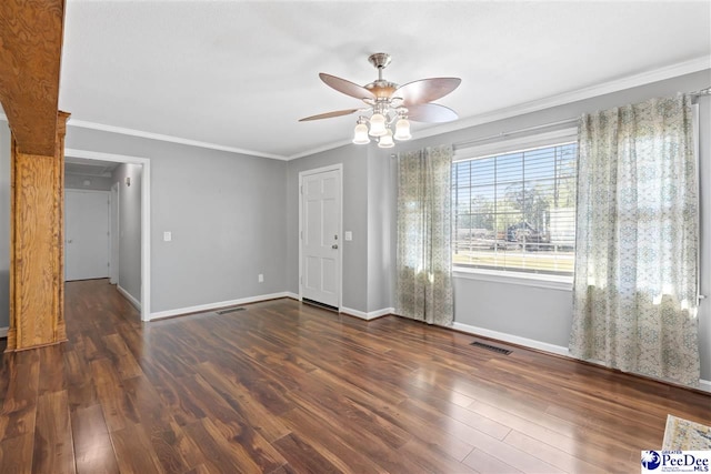 616 Forest Acres Dr, Pamplico, SC 29505 - empty room featuring ceiling fan, ornamental molding, visible vents, wood finished floors, and baseboards