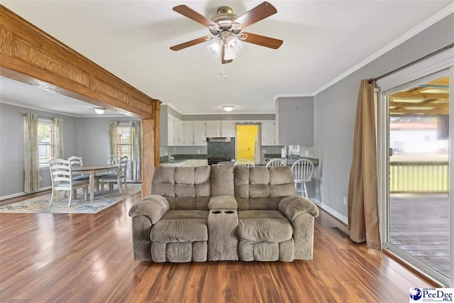 616 Forest Acres Dr, Pamplico, SC 29505 - living room featuring crown molding, baseboards, a ceiling fan, and wood finished floors
