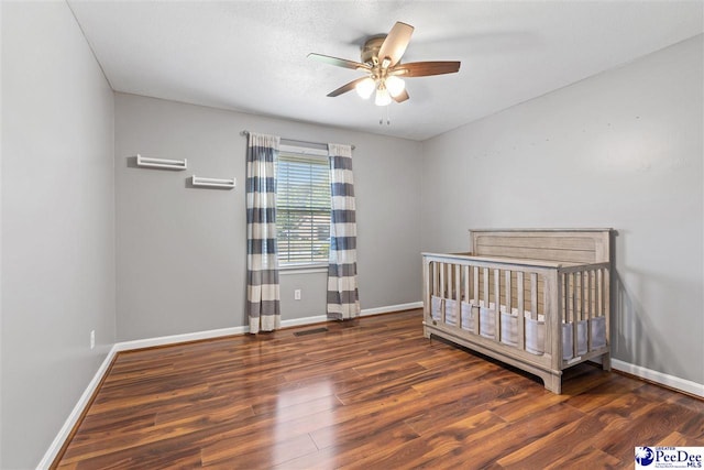 616 Forest Acres Dr, Pamplico, SC 29505 - bedroom featuring visible vents, baseboards, a ceiling fan, and wood finished floors