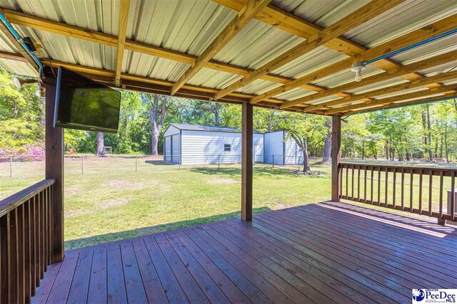 616 Forest Acres Dr, Pamplico, SC 29505 - wooden terrace with an outbuilding, fence, and a lawn