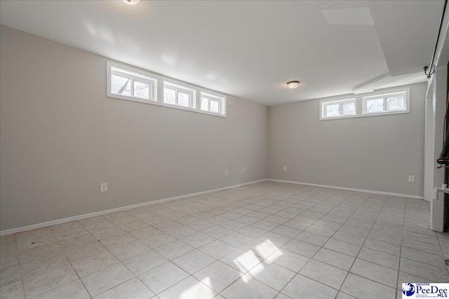 basement with light tile patterned flooring