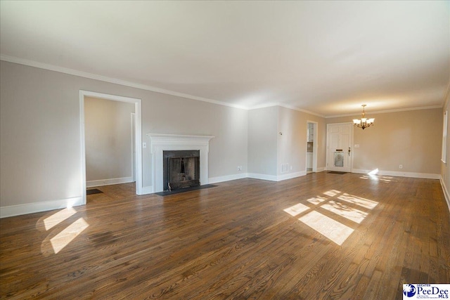 unfurnished living room with ornamental molding, dark hardwood / wood-style floors, and a chandelier