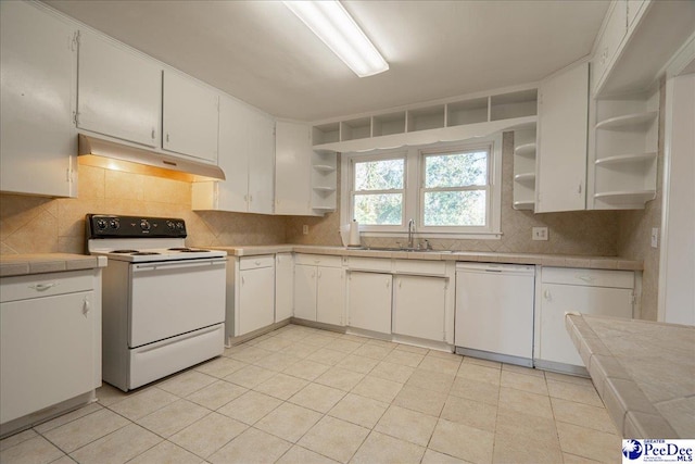 kitchen featuring white cabinetry and white appliances