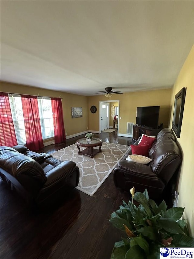 living room with ceiling fan and wood-type flooring