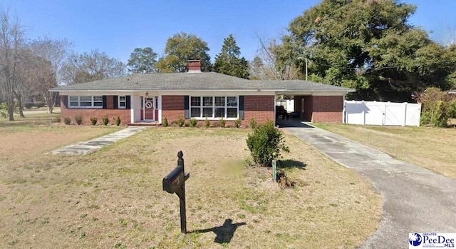 single story home with a carport and a front yard