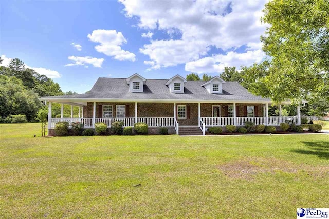 view of front facade with a front yard and covered porch