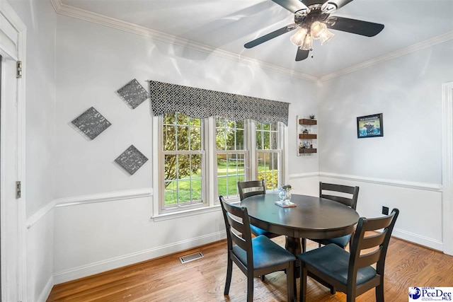 3312 Poplar Chase Ln, Florence, SC 29501 - dining room with ornamental molding, wood finished floors, ceiling fan, and baseboards