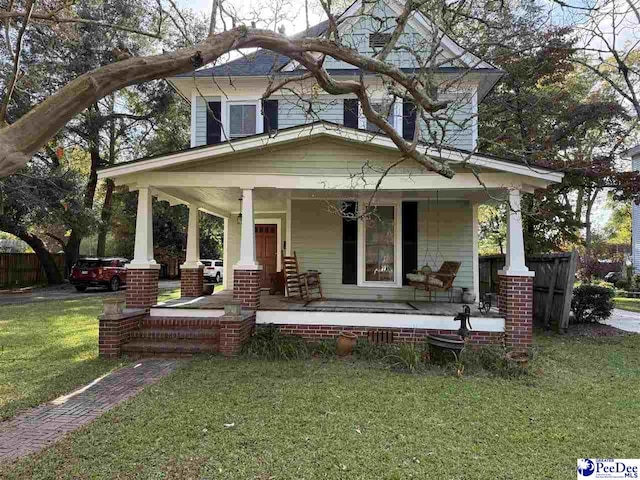 223 Third St, Cheraw, SC 29520 - view of front of home featuring a chimney, a front yard, and central AC
