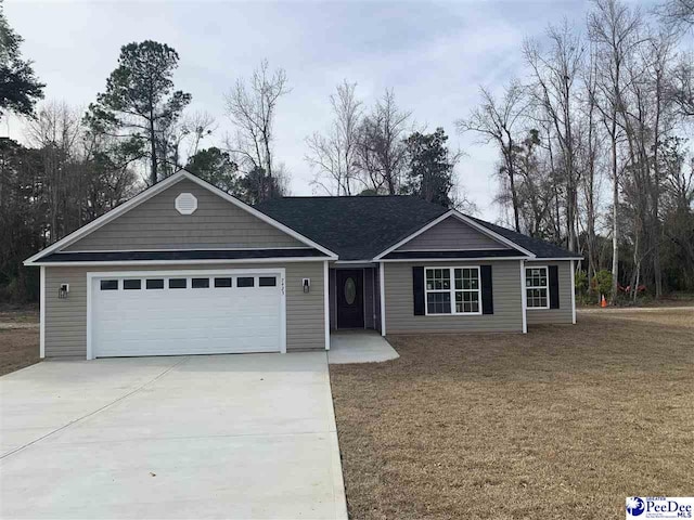 single story home with driveway, an attached garage, and a front lawn