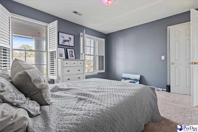 3202 W Hampton Pointe Dr, Florence, SC 29501 - carpeted bedroom with a textured ceiling