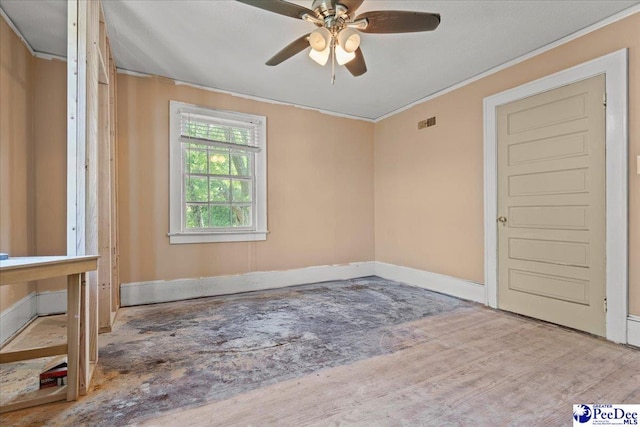 314 W Cedar St, Florence, SC 29501 - empty room with a ceiling fan, baseboards, visible vents, and ornamental molding