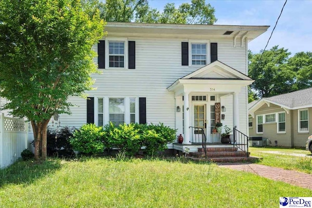 314 W Cedar St, Florence, SC 29501 - view of front facade with fence and a front lawn