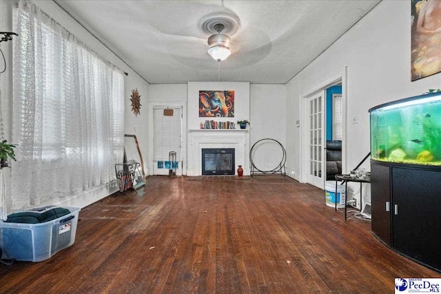 314 W Cedar St, Florence, SC 29501 - living room featuring a ceiling fan, wood finished floors, and a fireplace