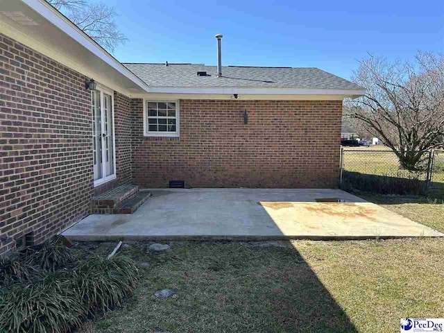 view of patio / terrace featuring fence