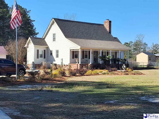 view of front of home featuring a porch and a front yard