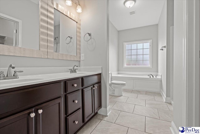 full bath with a sink, visible vents, double vanity, and a garden tub