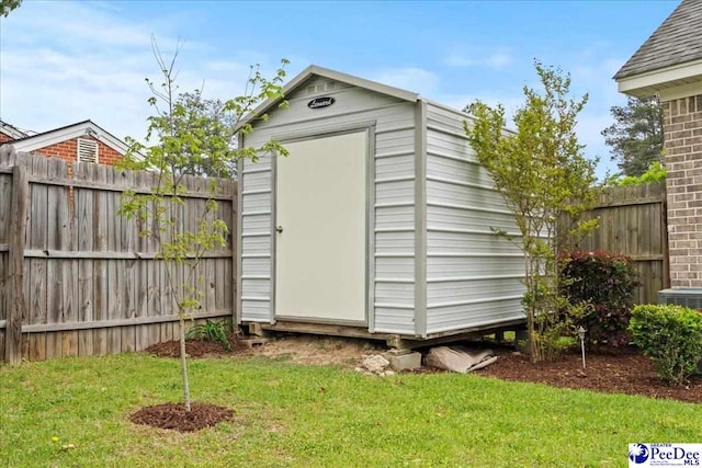 view of shed featuring a fenced backyard