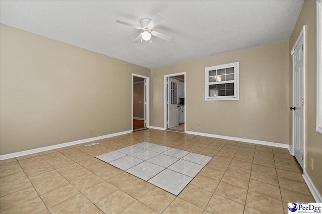 838 Greenwing Teal, Florence, SC 29505 - empty room featuring a textured ceiling, a ceiling fan, visible vents, light tile patterned flooring, and baseboards