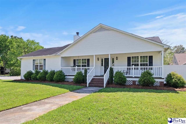 838 Greenwing Teal, Florence, SC 29505 - bungalow-style home with a front yard, covered porch, and a chimney