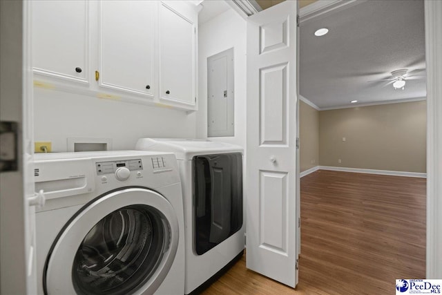 838 Greenwing Teal, Florence, SC 29505 - washroom with separate washer and dryer, electric panel, a ceiling fan, light wood-style floors, and cabinet space