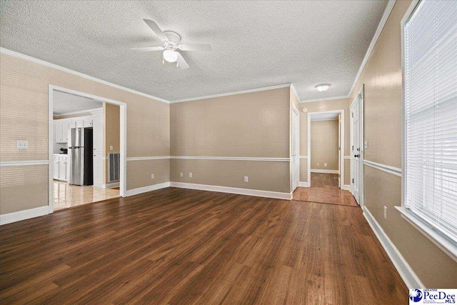 838 Greenwing Teal, Florence, SC 29505 - spare room featuring crown molding, a ceiling fan, and wood finished floors