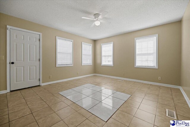 838 Greenwing Teal, Florence, SC 29505 - unfurnished room featuring light tile patterned floors, ceiling fan, a textured ceiling, visible vents, and baseboards