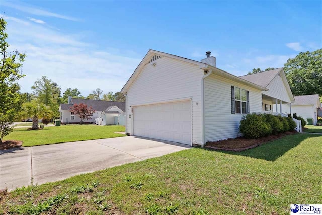 838 Greenwing Teal, Florence, SC 29505 - view of home's exterior with a lawn, a garage, driveway, and a chimney