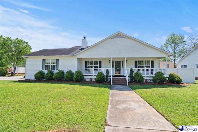 838 Greenwing Teal, Florence, SC 29505 - view of front of home with a porch, a chimney, and a front yard
