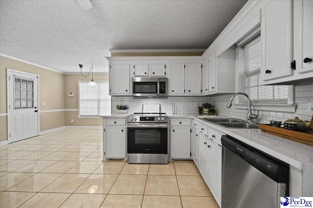 838 Greenwing Teal, Florence, SC 29505 - kitchen with light countertops, appliances with stainless steel finishes, decorative backsplash, and a sink