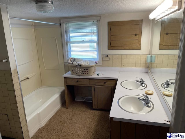 bathroom with vanity and a textured ceiling