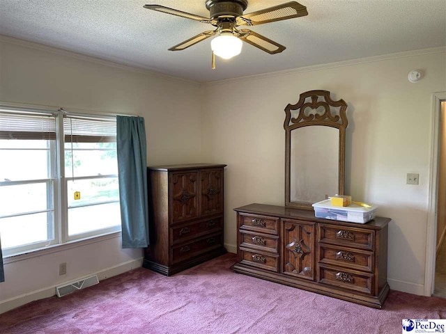 bedroom with crown molding, light colored carpet, and multiple windows