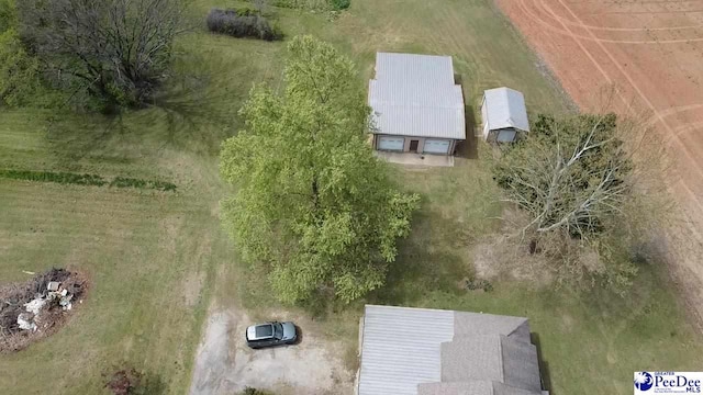 birds eye view of property with a rural view