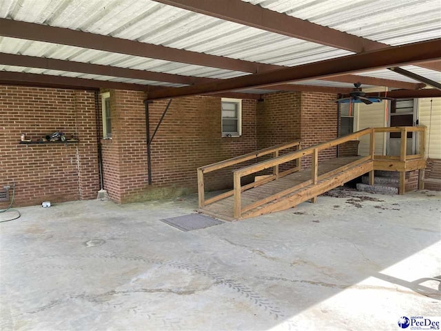 exterior space with ceiling fan