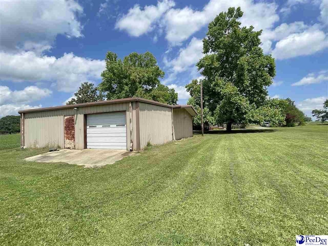 garage featuring a yard