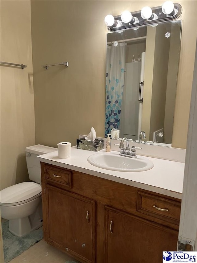 bathroom featuring vanity, a shower with curtain, and toilet