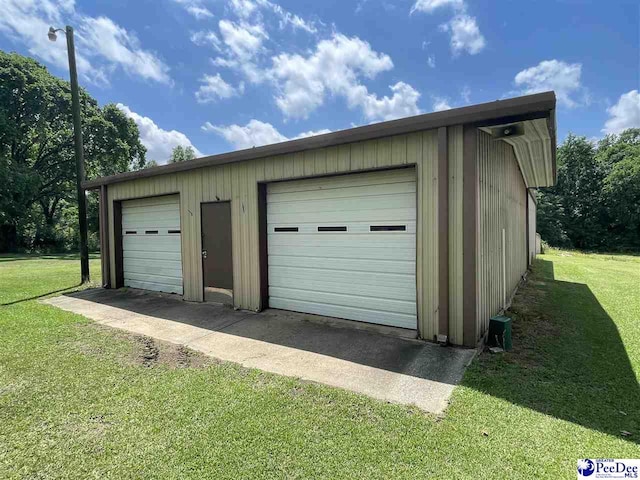 garage with a lawn