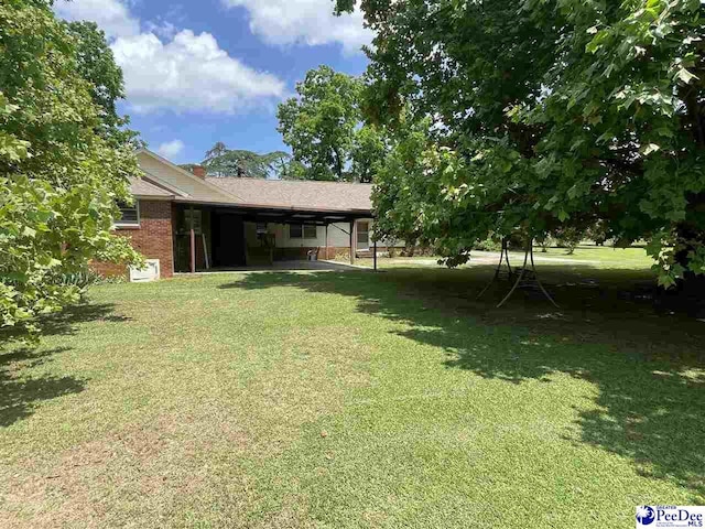 view of yard with a carport