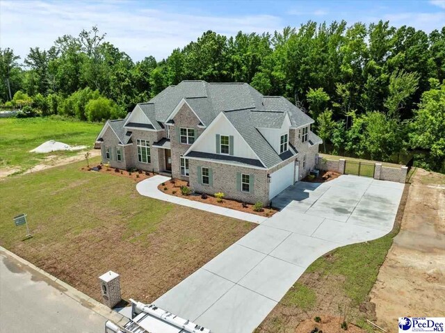 2528 Edinberg Way, Florence, SC 29501 - view of front of house with driveway, an attached garage, a shingled roof, and brick siding