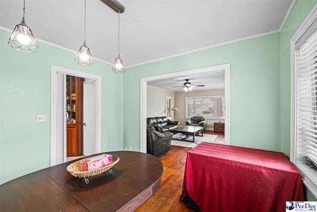 600 Greenway Dr, Florence, SC 29501 - dining area featuring crown molding, dark wood-type flooring, and a ceiling fan