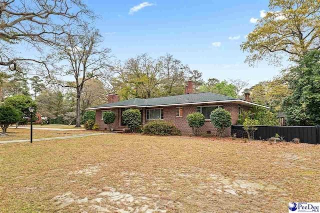 600 Greenway Dr, Florence, SC 29501 - ranch-style home featuring a front yard, brick siding, and a chimney